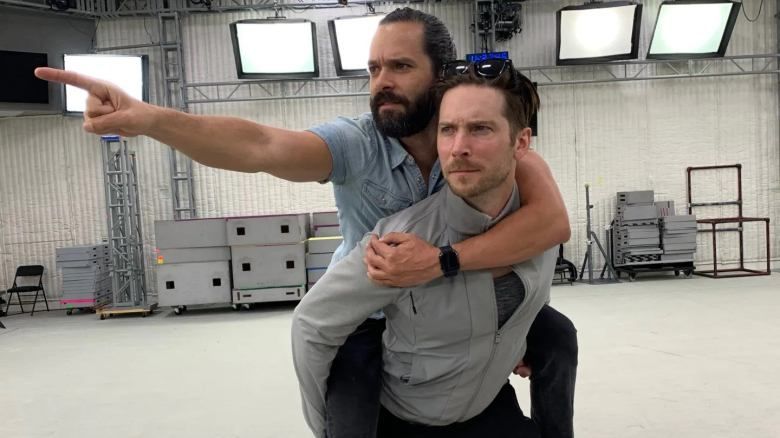 Troy Baker giving Neil Druckmann a piggy back on the set of The Last of Us Part 2